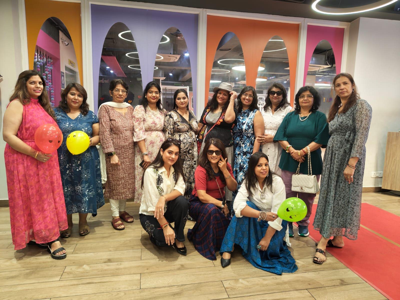 A community group celebrating together at a cafe gathering