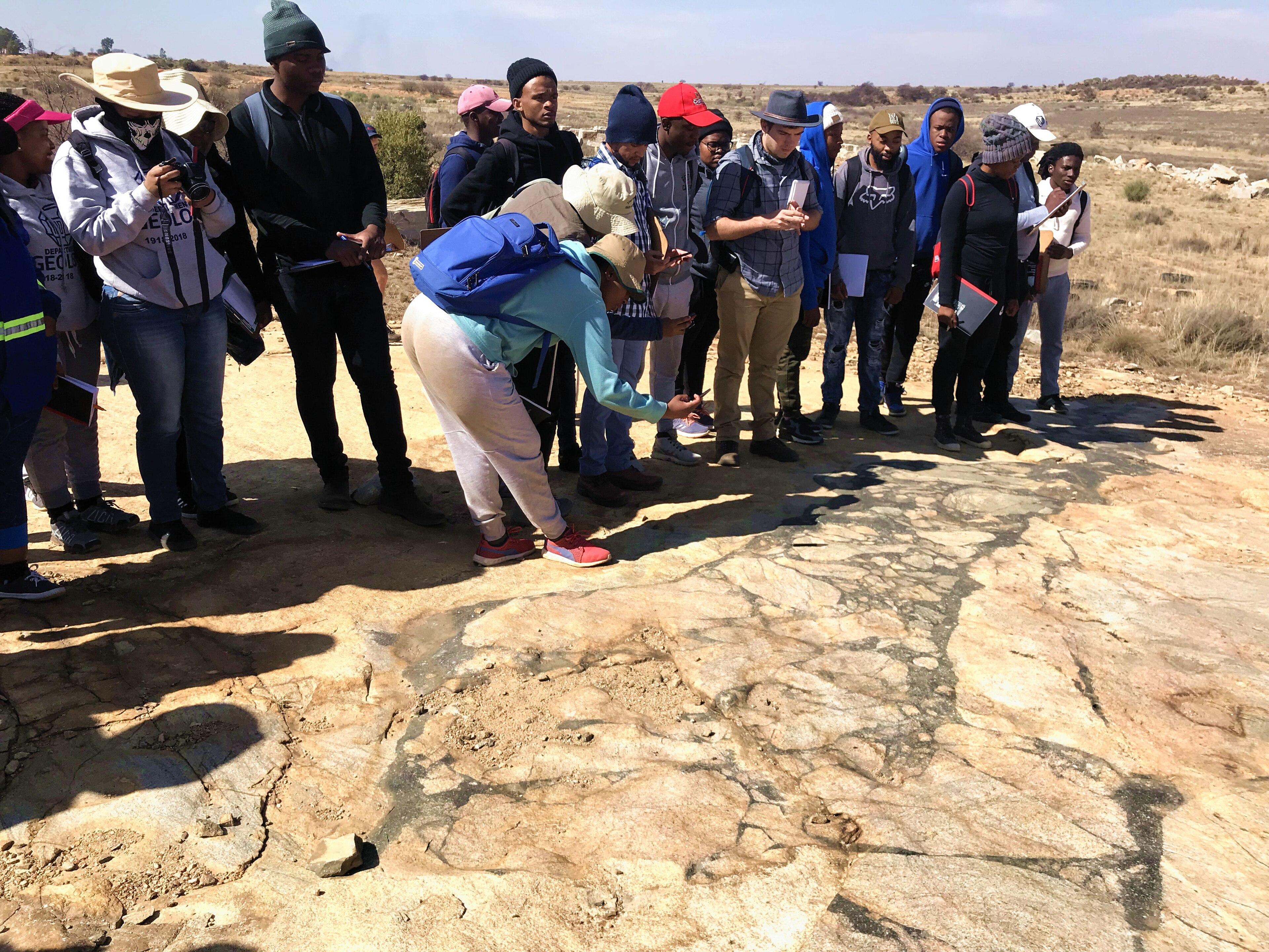 Participants exploring Himalayan geology in the field