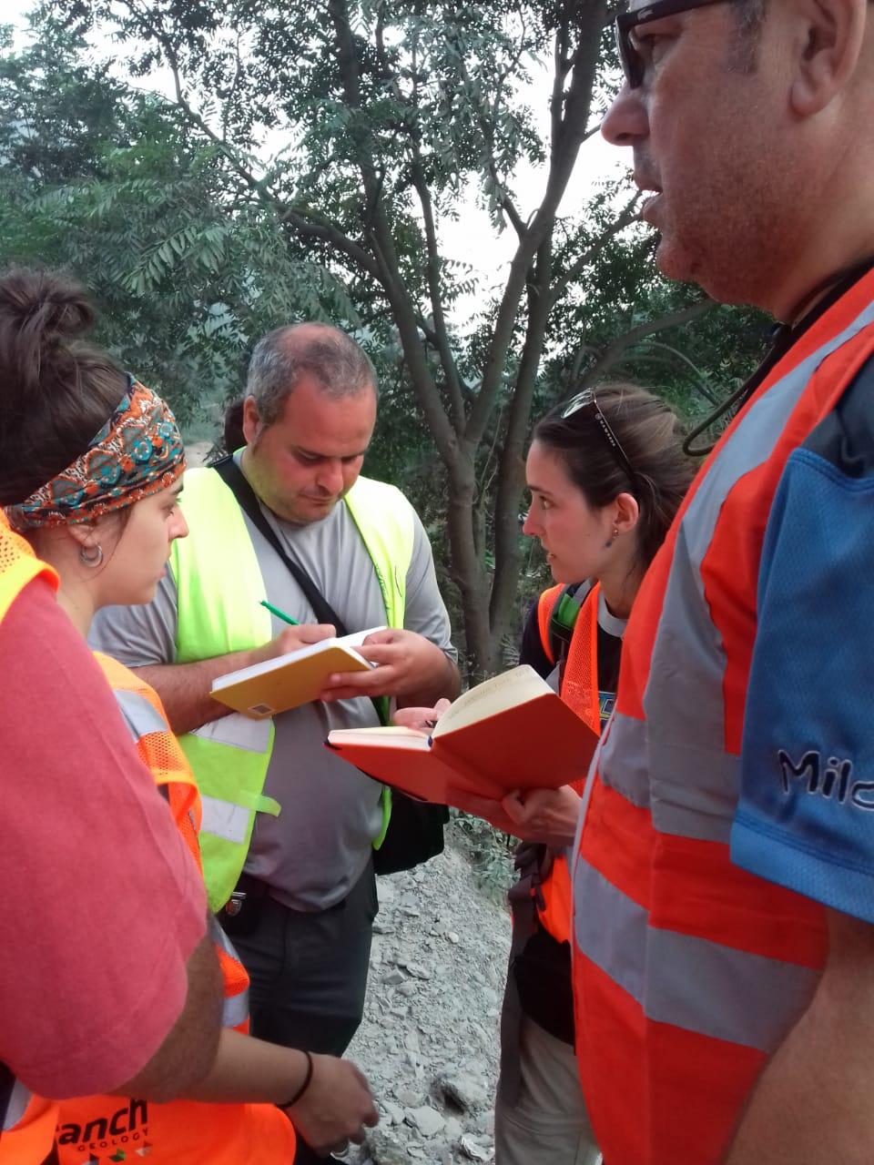 Participants recording observations in field notebooks