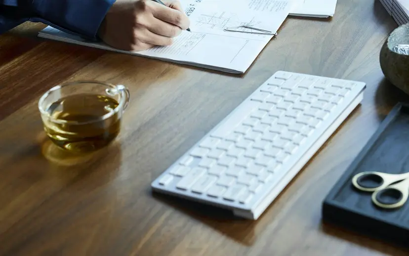 Writing desk with tender bid papers being drafted