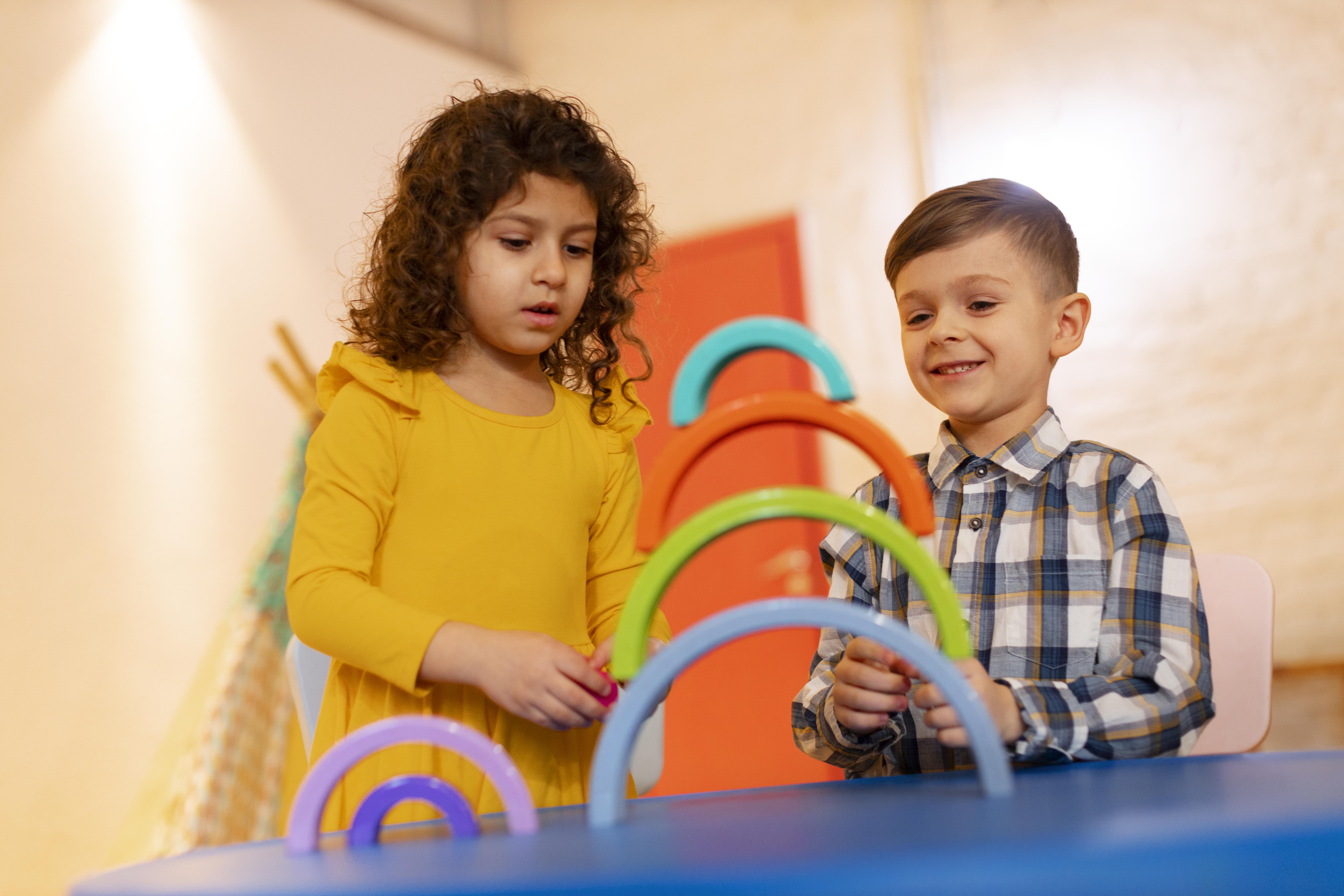 young-boy-girl-playing-indoors-with-eco-toys-A8sga1FrOkoSJ.jpg