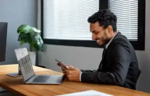 Employee booking a desk through a mobile app, highlighting mobile-first experience in hybrid workplaces.