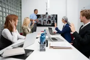 Hybrid legal workplace with in-office collaboration and remote participation, supporting teamwork, mentorship, and flexible work models.
