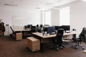 Spacious law firm office with large desks and minimal occupancy, highlighting underutilized workspace and excess real estate.
