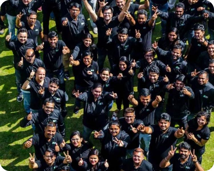 The MoveInSync team gathered on the lawn for a company photograph