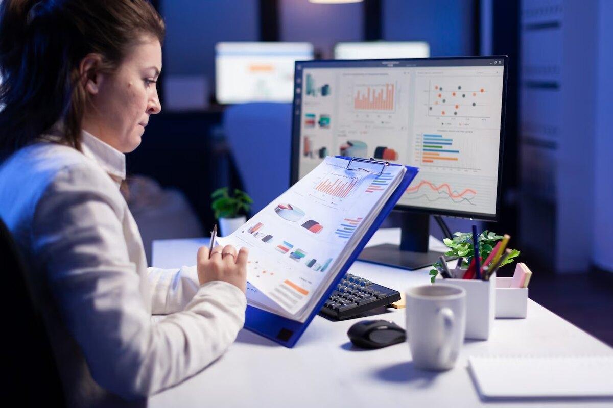 A workplace admin reading attendance and utilization dashboards