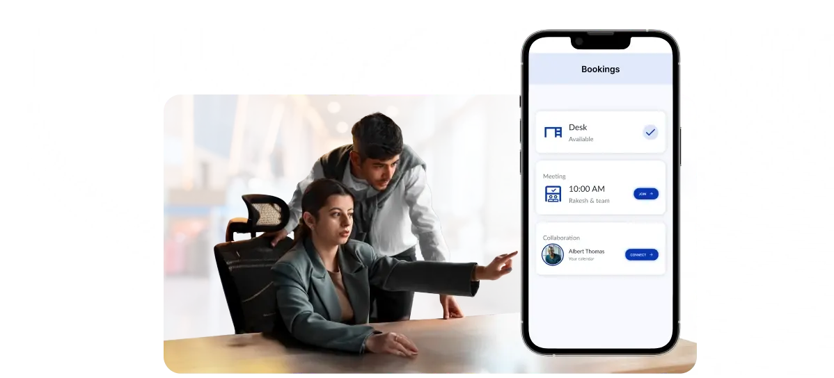 Colleagues at a desk beside a phone showing desk, meeting and collaboration bookings