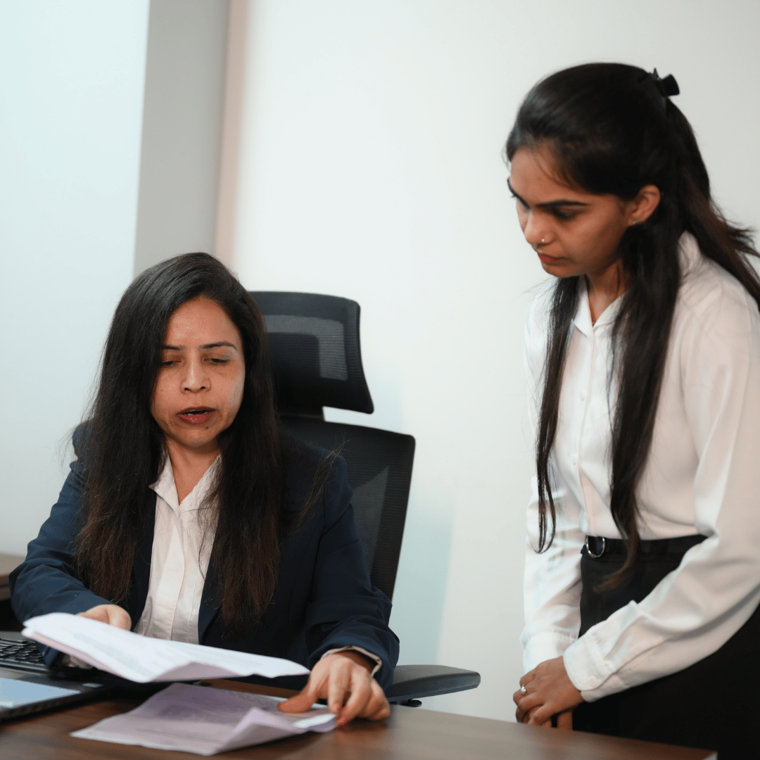 CRS professionals reviewing corporate documents