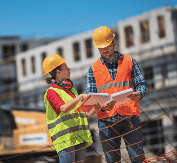 Two Armkon engineers reviewing drawings on site